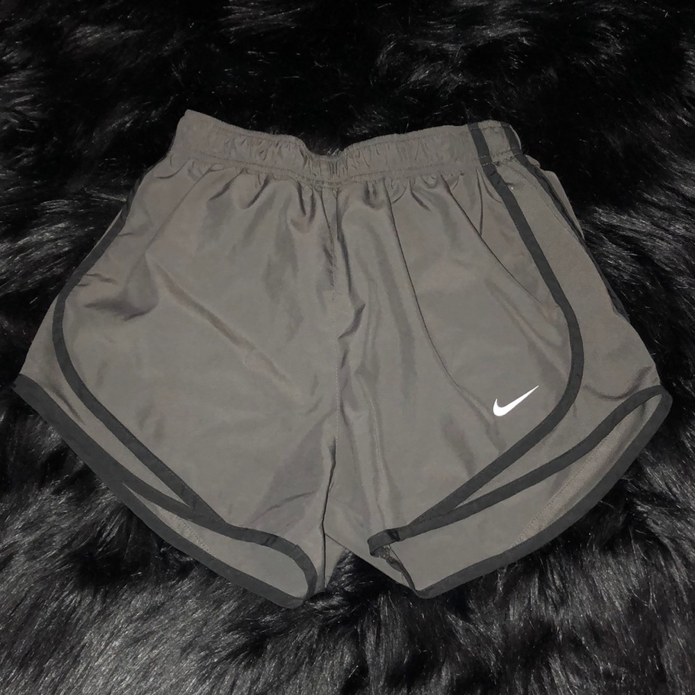 Grey and Black Nike shorts.